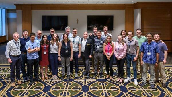 a cohort of students in Notre Dame's online master's in data science program pose for a group photo