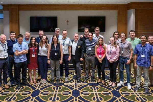 a cohort of students in Notre Dame's online master's in data science program pose for a group photo