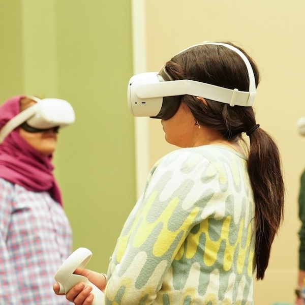 Students in headsets going through a virtual reality experience.