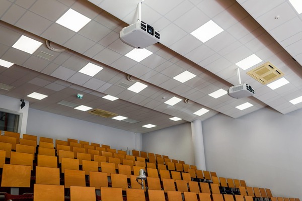 empty lecture-style classroom with theatre seating