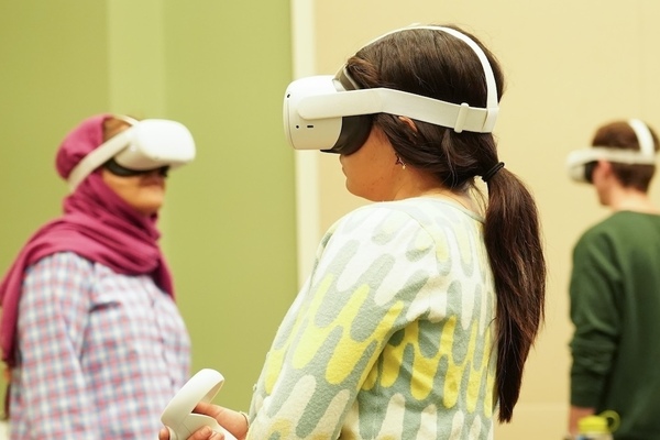 three architecture students in VR headsets go through the virtual HafenCity experience