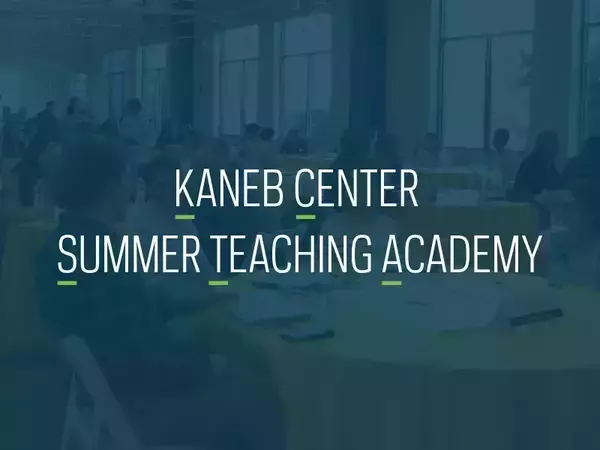 A graphic that reads Kaneb Center Summer Teaching Academy in white with letters of the words underlined to indicate the academy's acronym, KCSTA. There is a photo of people at tables talking in the background, which is blue.