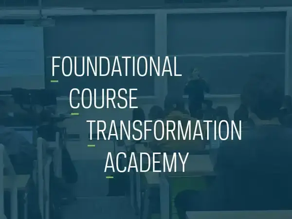 White text that reads Foundational Course Transformation Academy over a blue-tinted photo of a professor speaking to a class. The first letter of each word is underlined in green to indicate the program's acronym (FCTA).